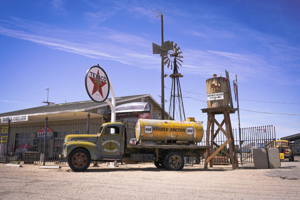 Iconic vintage Texaco gas station at Kramer Junction, featuring an old tanker truck and windmill.